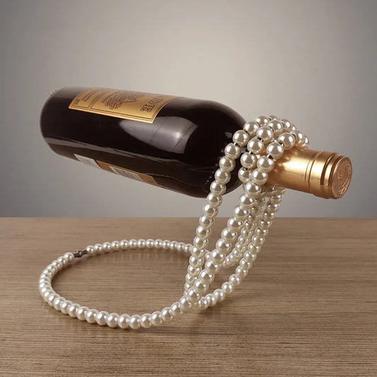 Porte bouteille en Collier à perles.